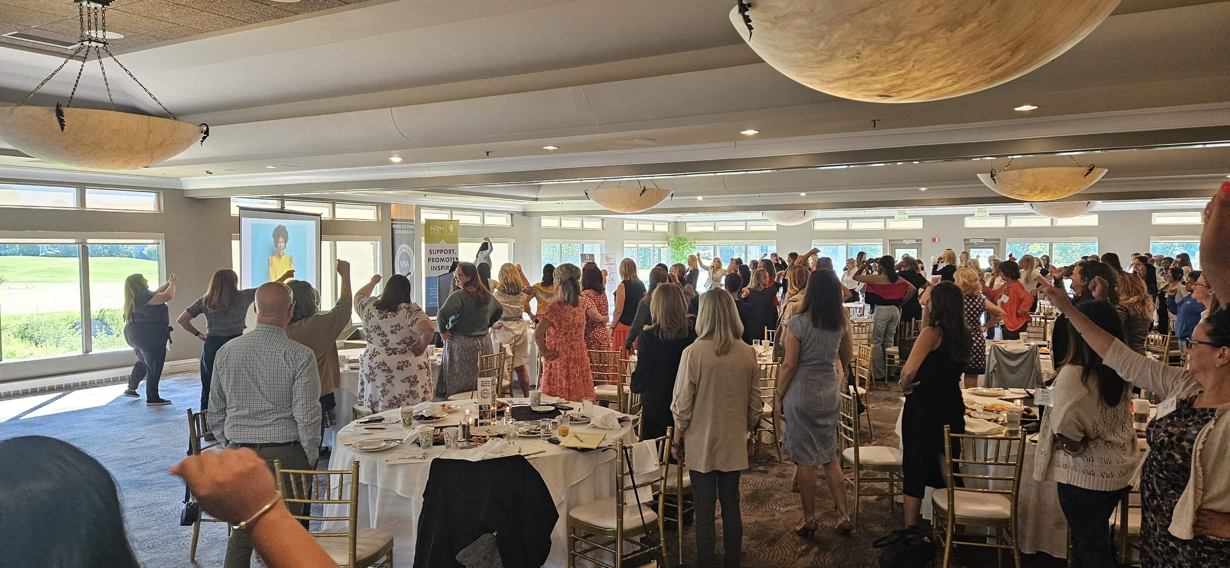 Dr. Donna Marino on stage at a keynote